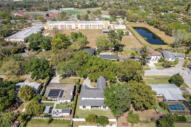 drone / aerial view with a residential view and a water view