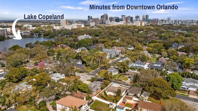 birds eye view of property with a view of city and a water view