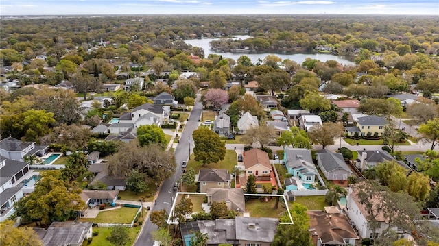 bird's eye view featuring a water view and a residential view