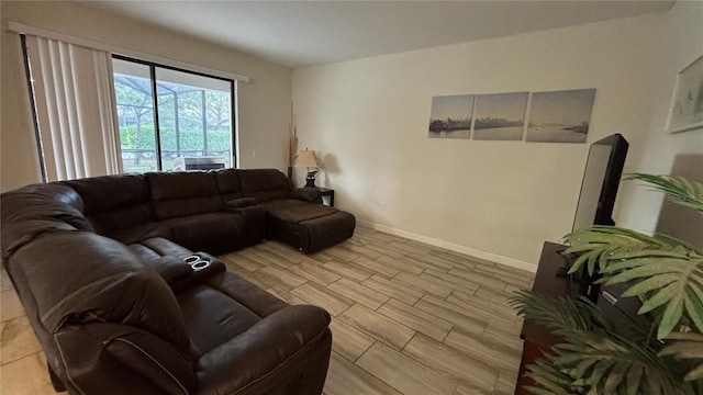 living room with wood finish floors and baseboards