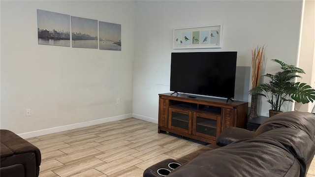 living room featuring baseboards and wood finished floors