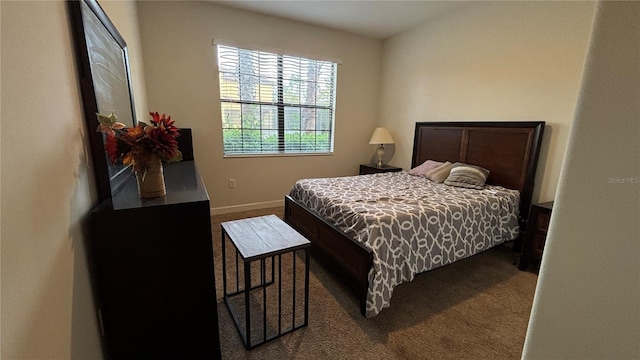 bedroom with baseboards and carpet flooring