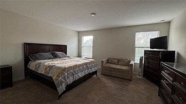 bedroom with carpet and baseboards