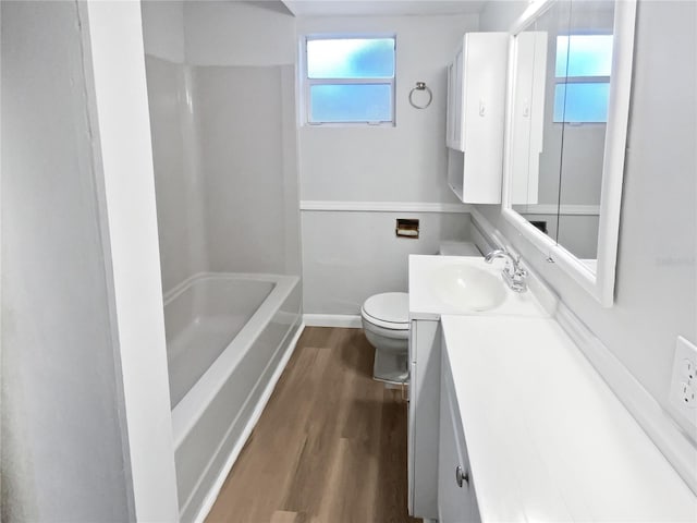 full bath with vanity, toilet, and wood finished floors