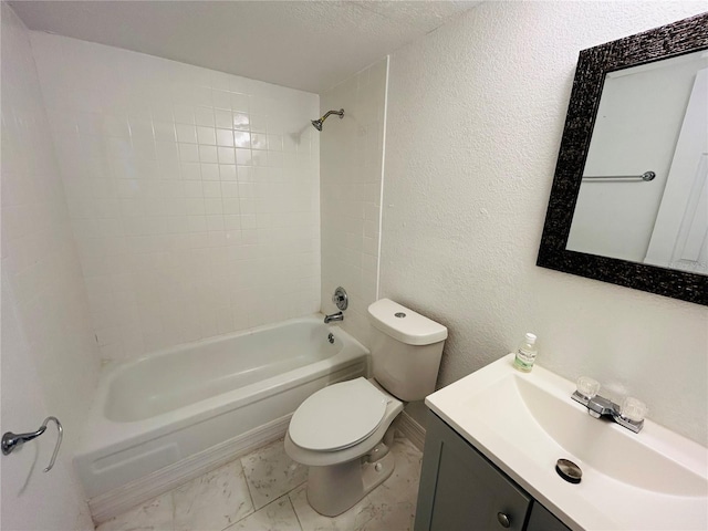 full bathroom with vanity, toilet, shower / bathing tub combination, and a textured wall