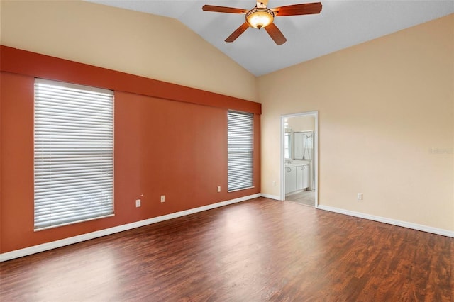 unfurnished room featuring vaulted ceiling, wood finished floors, baseboards, and ceiling fan