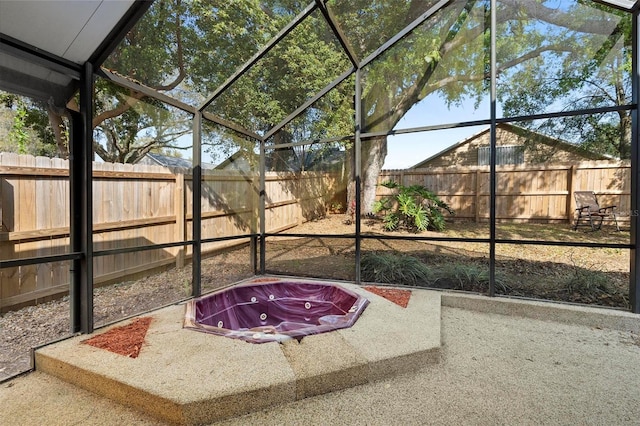 unfurnished sunroom with a hot tub