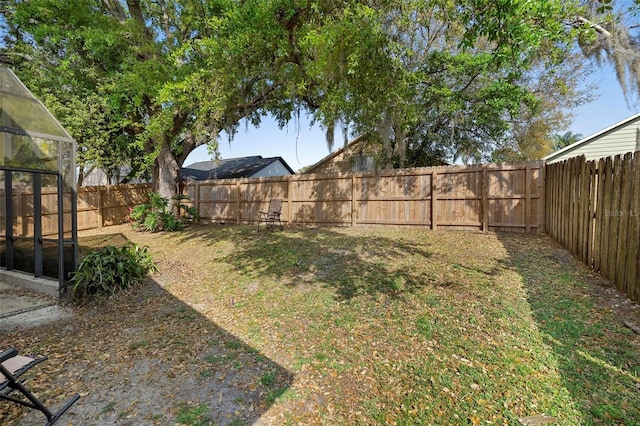 view of yard featuring a fenced backyard