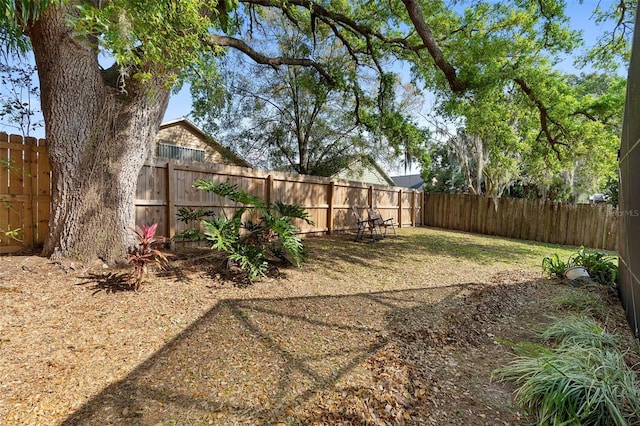 view of yard featuring a fenced backyard