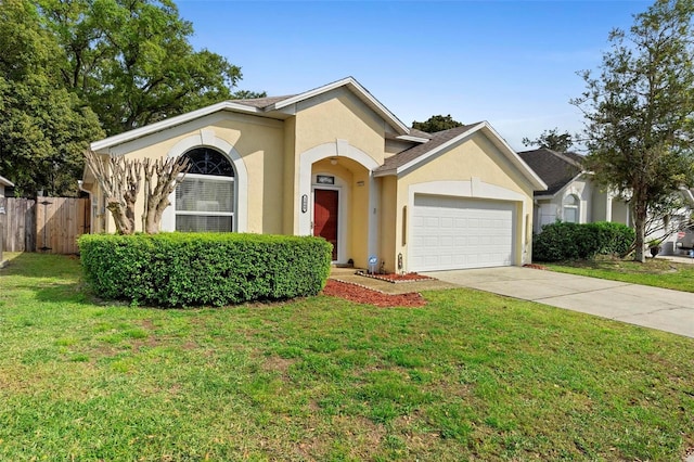 view of front of house featuring fence, an attached garage, stucco siding, concrete driveway, and a front lawn