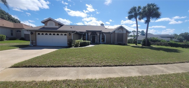 4421 Steed Ter, Winter Park, FL 32792 - view of front of home featuring a front lawn, an attached garage, and driveway