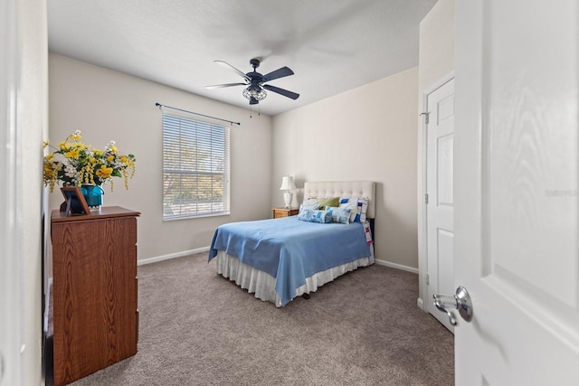 carpeted bedroom featuring ceiling fan and baseboards