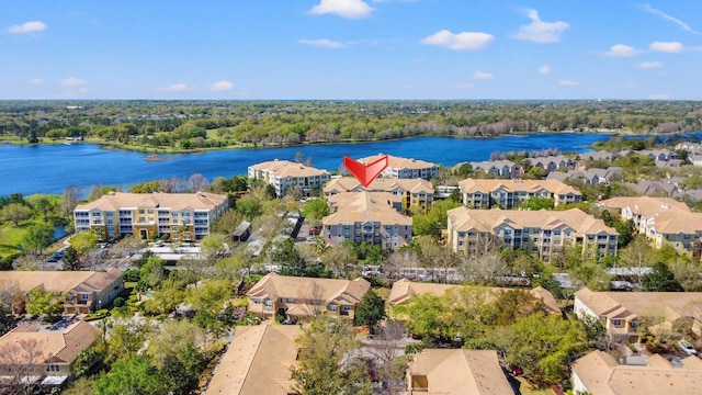 birds eye view of property with a water view and a residential view