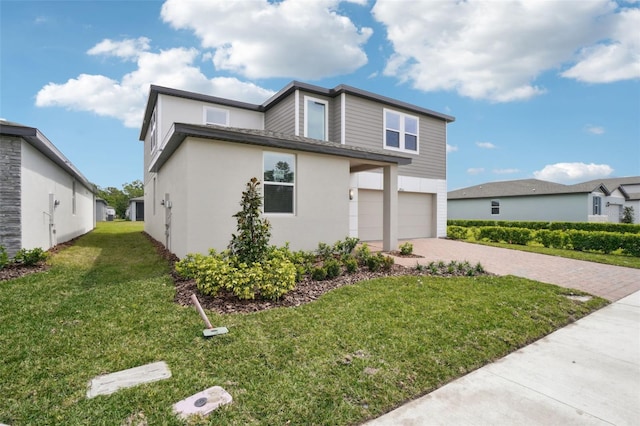 view of front of house with a front lawn, a garage, decorative driveway, and stucco siding