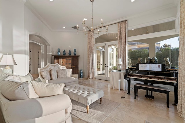 living room featuring a notable chandelier, ornamental molding, recessed lighting, french doors, and arched walkways