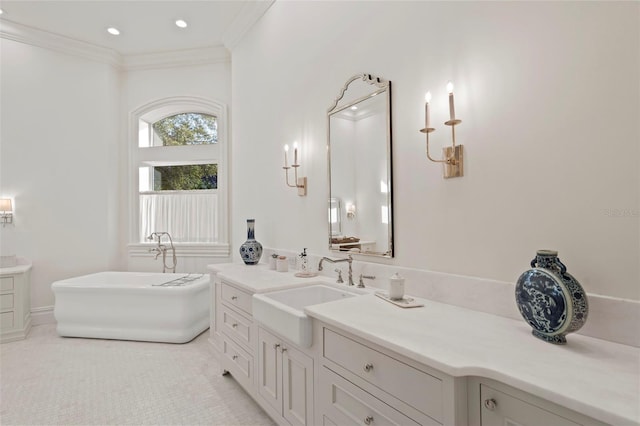 full bath featuring recessed lighting, vanity, a freestanding bath, and crown molding