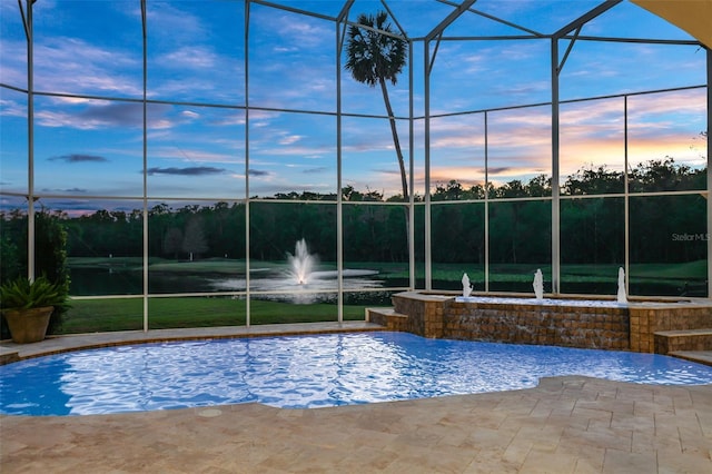 view of swimming pool with a lanai