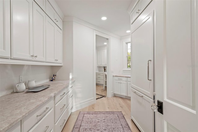 kitchen with recessed lighting, white cabinets, and light wood finished floors