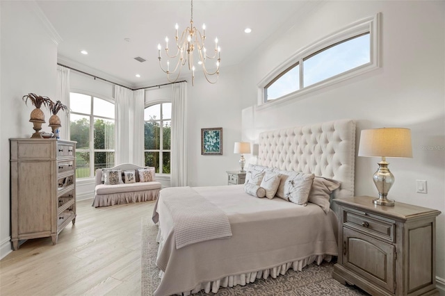 bedroom featuring recessed lighting, multiple windows, light wood-style floors, and a chandelier