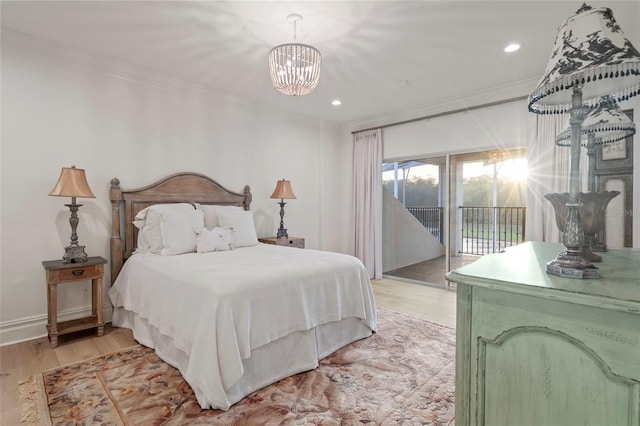 bedroom with an inviting chandelier, recessed lighting, ornamental molding, access to exterior, and light wood-style floors