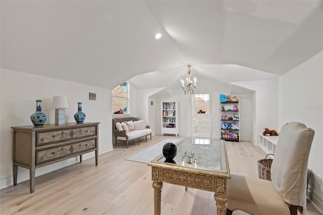 home office with visible vents, a notable chandelier, light wood-style flooring, plenty of natural light, and vaulted ceiling