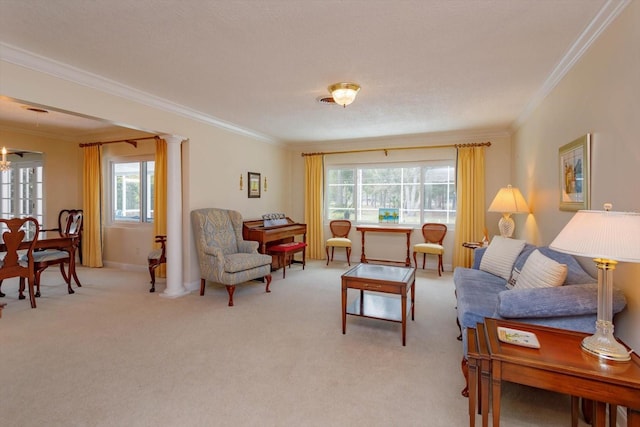 living room with crown molding, decorative columns, a wealth of natural light, and light carpet