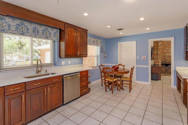 kitchen featuring a sink, recessed lighting, light countertops, light tile patterned floors, and dishwasher