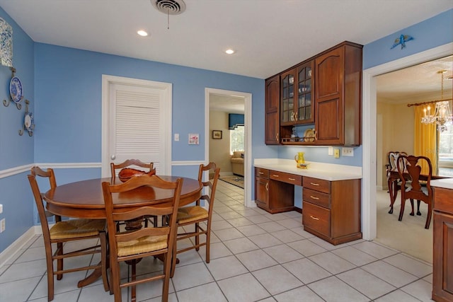 dining area with visible vents, built in desk, recessed lighting, baseboards, and a chandelier