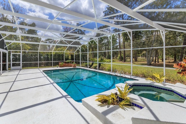 view of pool with a lanai, a patio area, and a pool with connected hot tub