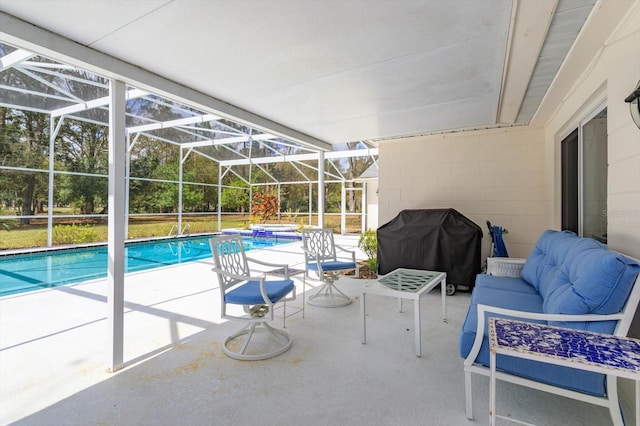 pool with glass enclosure, an outdoor hangout area, a grill, and a patio area