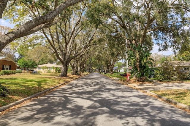 view of road featuring curbs