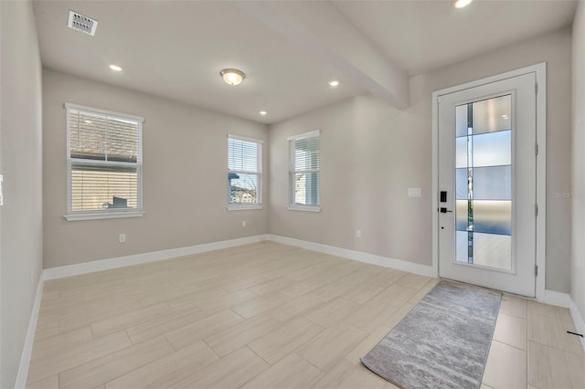 foyer entrance with recessed lighting, visible vents, baseboards, and beamed ceiling