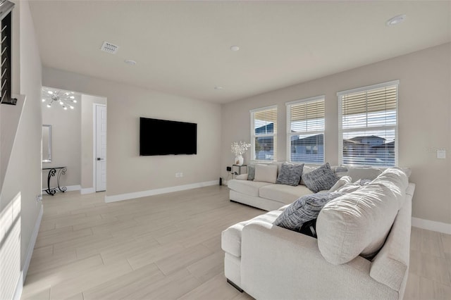 living room featuring visible vents and baseboards