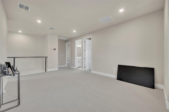 carpeted spare room with recessed lighting and visible vents