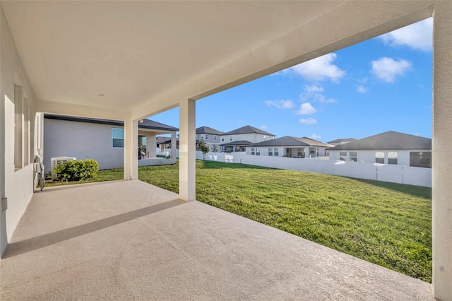 view of patio / terrace featuring a residential view and fence