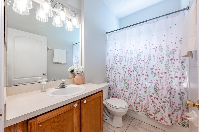 full bath featuring a textured ceiling, toilet, vanity, and tile patterned flooring