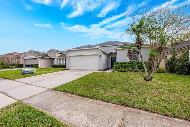 view of front of property with stucco siding, driveway, a front yard, and a garage