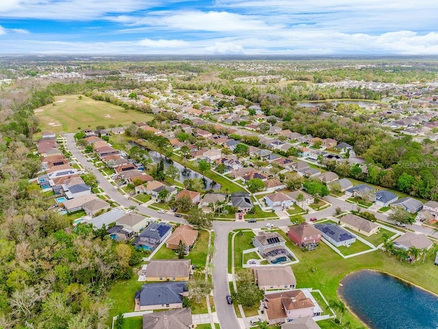 birds eye view of property with a residential view and a water view