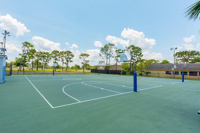 view of basketball court featuring community basketball court and fence