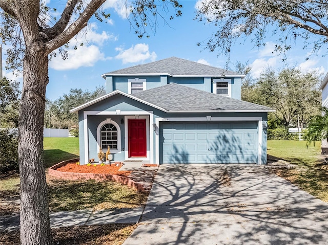 traditional home with a front lawn, roof with shingles, stucco siding, driveway, and an attached garage