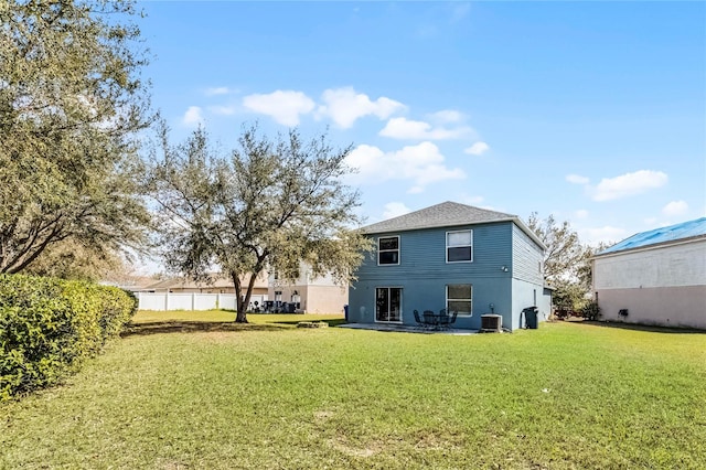 back of house with a patio area, a yard, cooling unit, and fence