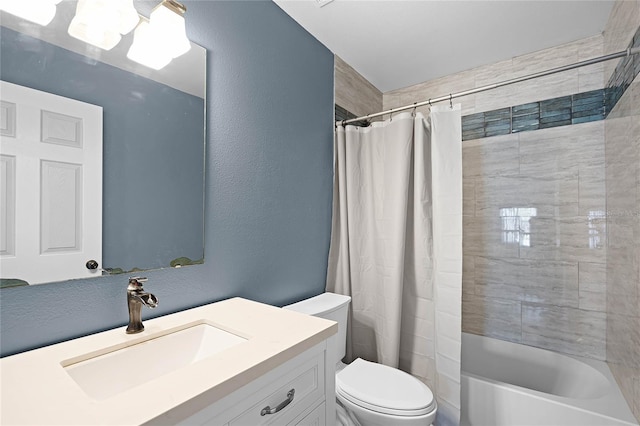 full bathroom with toilet, vanity, a textured wall, and shower / bathtub combination with curtain