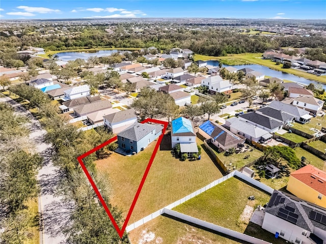 bird's eye view featuring a residential view and a water view