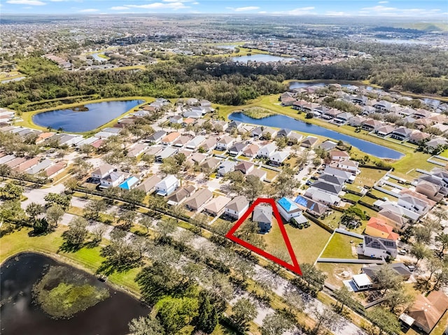 birds eye view of property featuring a residential view and a water view