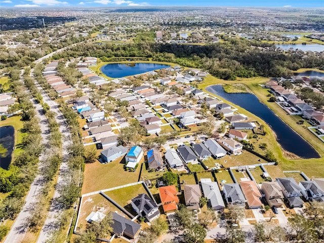 bird's eye view with a residential view and a water view