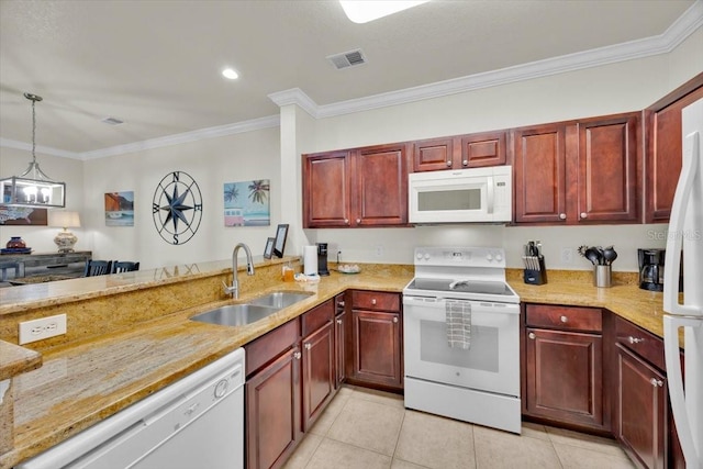 kitchen featuring visible vents, a sink, white appliances, crown molding, and dark brown cabinets