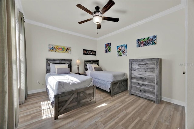 bedroom with light wood-type flooring, baseboards, ceiling fan, and crown molding