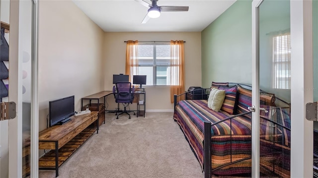 home office with ceiling fan, baseboards, and carpet