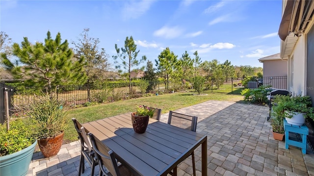 view of patio featuring outdoor dining space and a fenced backyard