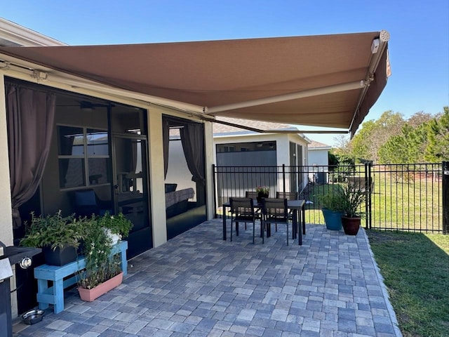 view of patio / terrace featuring outdoor dining space and fence